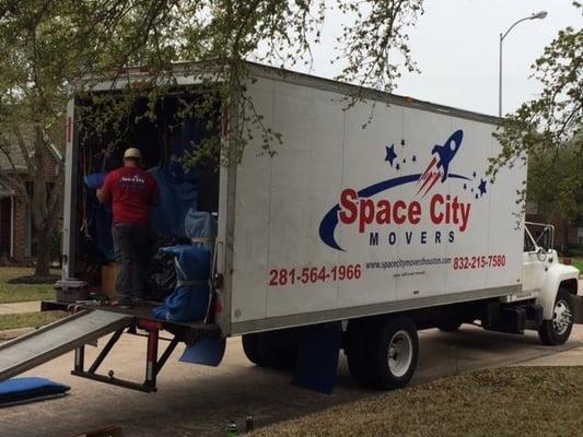 Our crew loading the items into the truck.