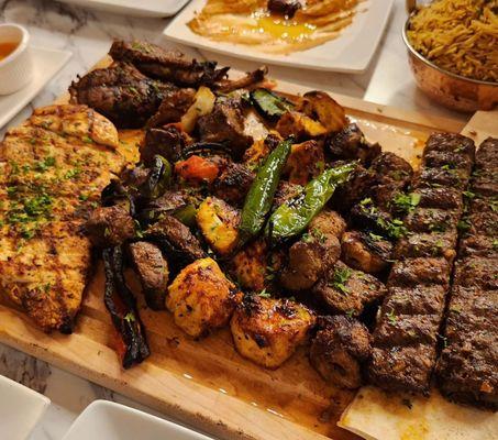 Meats from Deluxe family platter: kebobs-beef, taouk, kafta, lamb  Lamb chops  Grilled chicken