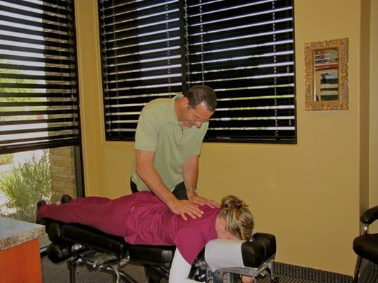 Dr. Neil T. Dende treating a patient.