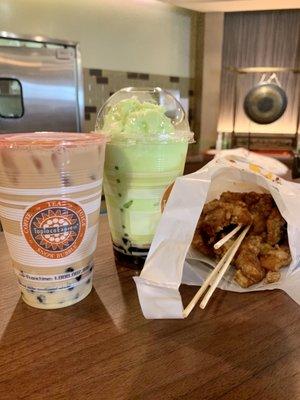 Vietnamese ice coffee with boba, honeydew snow bubble with boba and chicken snack.