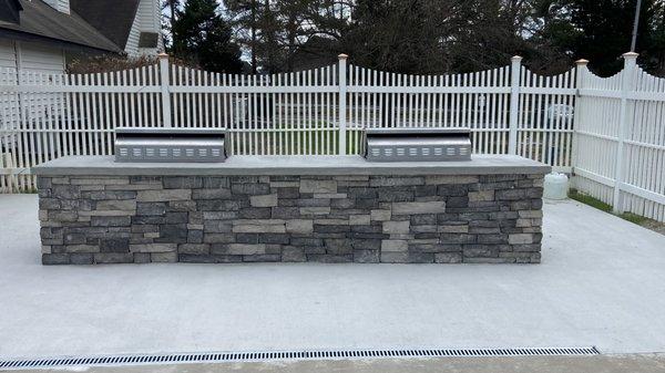 New concrete pad and new stone grills