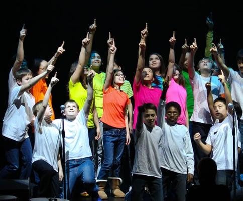 Students lead and participate in a school wide praise and worship during the weekly chapels.