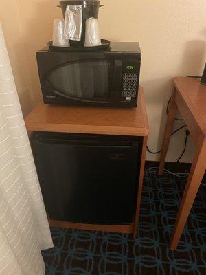 Microwave and cups and ice container