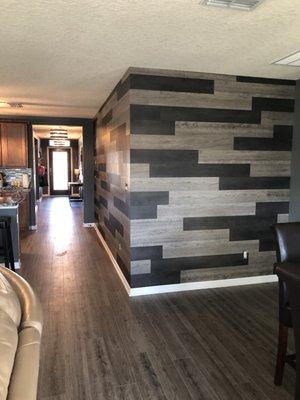 LVP flooring , and two different colors of  LVP on the accent wall