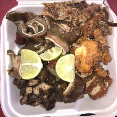 Mixed fried food including pig ears, tenders, fried pork, longaniza some pulled pernil (Roast pork) and pork chicharron with meat.