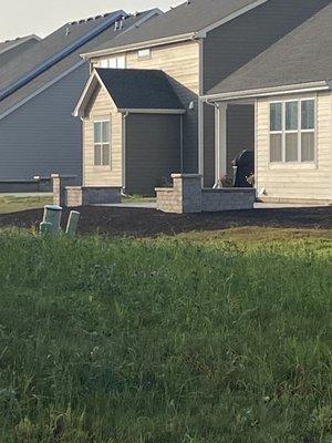 Patio and front landscaping.  Love the lighting and Unilock material.