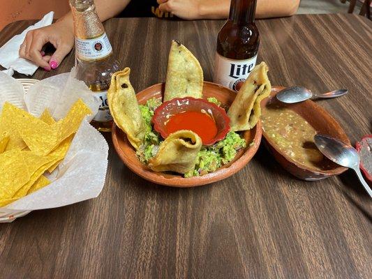 Black bean empanadas with fresh guacamole and frijole dip.