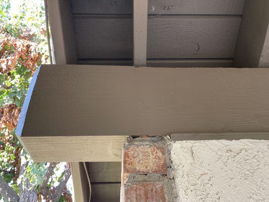 This wood beam was cut above the bricks and the end piece replaced. See the seam? You can but only if you look really, really hard.