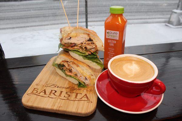 Spicy turkey, cappuccino, and a pure green cold pressed juice.