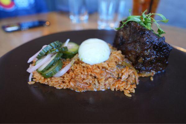 Korean short rib with kimchee fried rice, Porsches egg, and pickled cucumbers