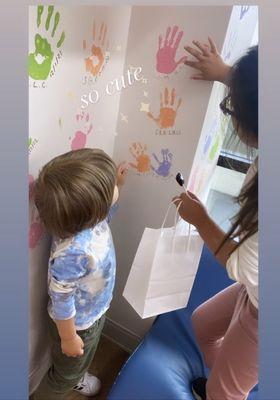 All the kids can put their hand prints on a designated wall !! It is soo cute and kids have fun doing it