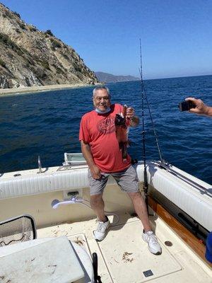 Dad holding up a sheepshead off of Catalina