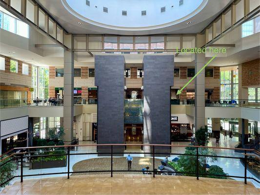 The interior of the building is large with many places to sit and even a grand piano