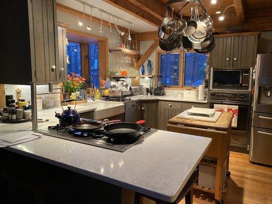 Finished kitchen with new shelves wine glass holder and of course the incredible L G quartz countertops installed by caliber Granite