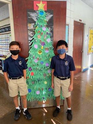 HFCA 6th graders with their classroom's Christmas tree.