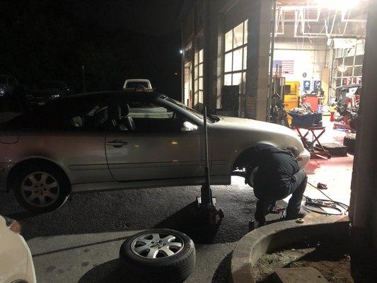 Edgar on one side, Rahon on the other at 8 Pm putting the car back together in the dark because the shop is full.