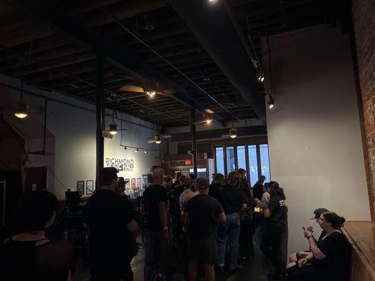 Bar at front door, merch line