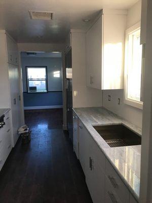 Kitchen floor, drywall, and painting done by Andrews Construction.