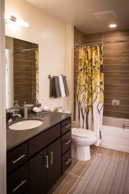 Stone vanity and ceramic tile.