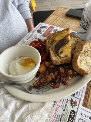 Corned beef hash, poached eggs, hash browns, and sour dough pumpernickel toast