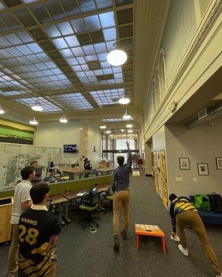 Our awesome members enjoying a game of corn hole during Happy Hour (hosted Thursdays at 3:58pm)