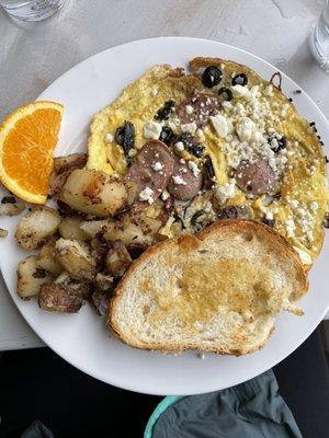 Sundried-tomato, olives and feta frittata with chicken sausage; comes with potatoes and homemade toast!