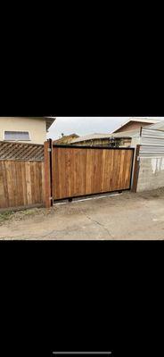 New installation,Sliding gate , redwood and iron frame combination, with solar sliding gate operator Los Angeles.