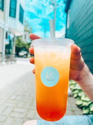 Mango fruit tea with strawberry boba