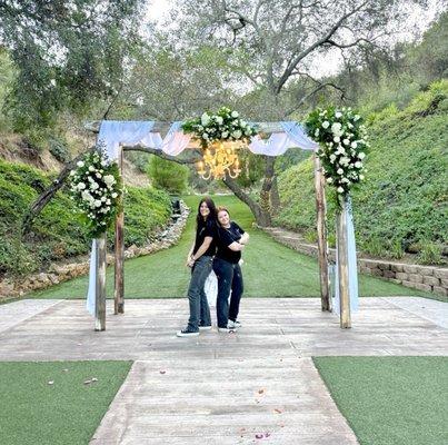 Owners Jane and Arielle Fallbrook wedding arch flowers