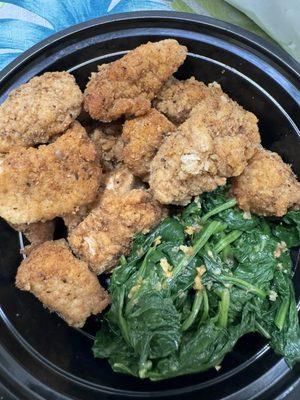 Chicken nuggets and sautéed spinach