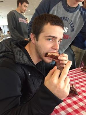 This is my friend not enjoying his food. (The ribs fucking suck)