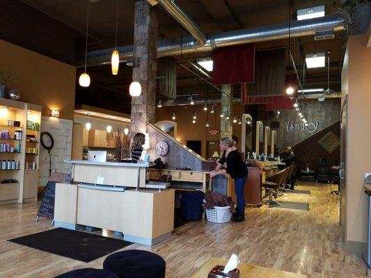 Inside of Vanity Salon and employees folding towels.