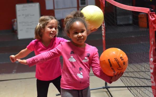 Kylie and Ryan practice their volleyball serves!