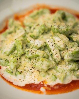 House-made, hand-made potato-free spinach and ricotta gnocchi in tomato-cream