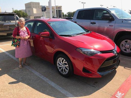 One of our favorite clients with her new red Corolla!