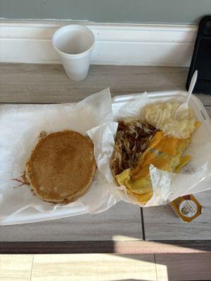 Bacon omelette with grits, hash browns and pancakes