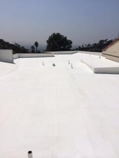 White solar reflective elastomeric roof upgrade coating