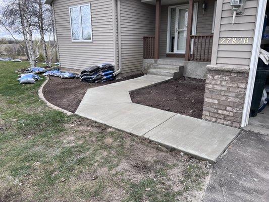 Concrete sidewalk & steps.