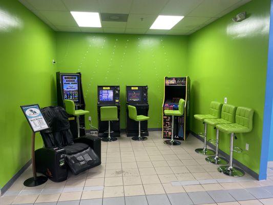 Video slot machines, Pac-Man, and a massage chair will help you pass the time (and maybe win some money!)