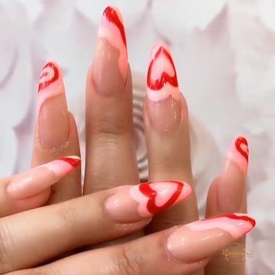 Acrylic set with pink and red swirl designs