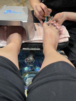 John making sure my pedicure is perfect