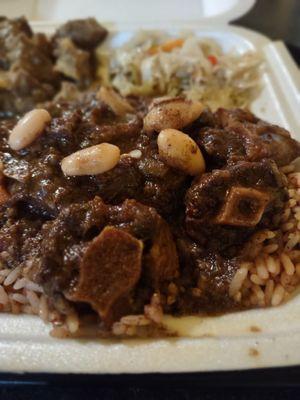 Curry Goat and Oxtail Combo, Beans, Rice, Cabbage Stir Fry. Shredded cabbage, carrot and red bell peppers cooked to perfection.