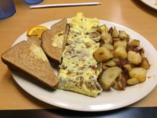 Bacon, mushroom and cheese omelette with hash browns