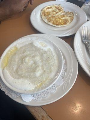 Grits extra butter with eggs fried