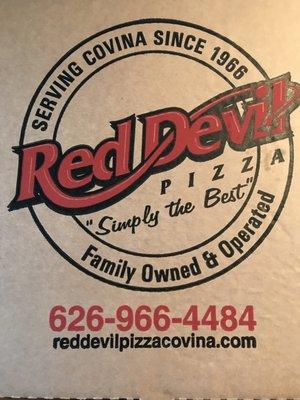 Pizza box with logo and info.