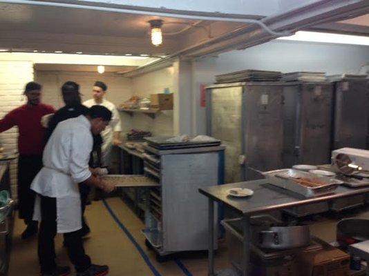 Tapuz culinary team of cooks in a NYC catering kitchen