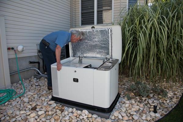 One of our technicians inspecting a generator