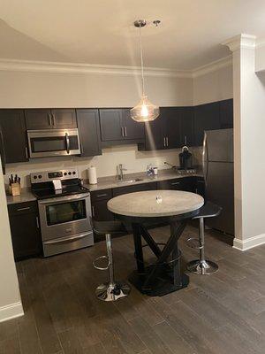 Kitchen with coffee maker and full size fridge