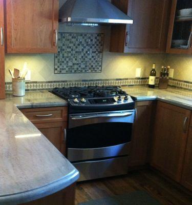 Tile behind stove top.