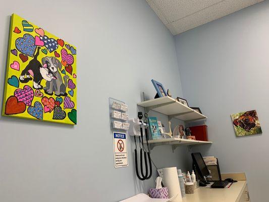 Exam room with pet art.